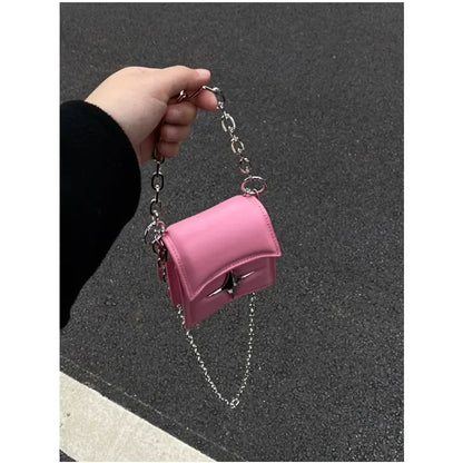 Bolso con cadena y cruz - rosa