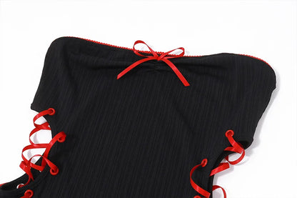 Vestido negro con lazo.