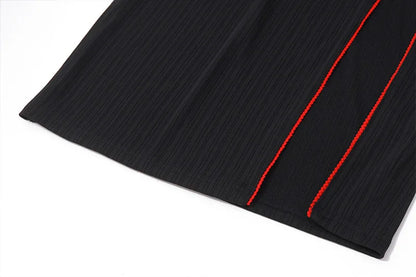 Vestido negro con lazo.